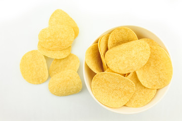 potato chips on bowl on white background.