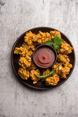 Crispy Corn pakora/pakoda, bhajji, Bhaji, bajji or pattice . served with tomato ketchup