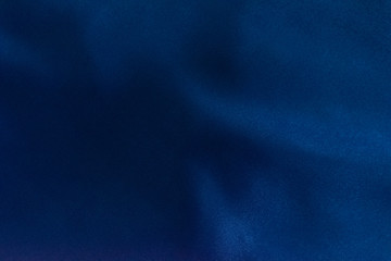 Luxury deep blue fabric background.Smooth pattern.Silk velvet material texture.Using for backdrop...