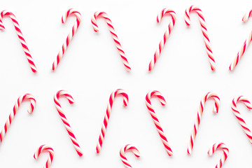 Christmas candy cane pattern on white background top-down