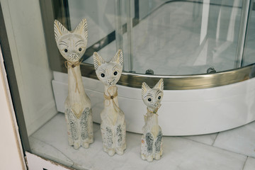Three decorative figurines of cats made of wood. Handmade.