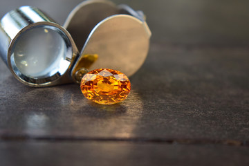 Yellow gem Beautiful on the wooden floor	