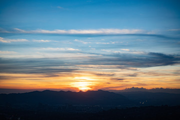 Wispy sunset of blues and oranges over Los Angeles, CA