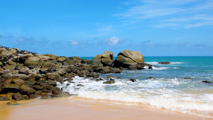 Fototapeta na wymiar Tropical beach, boulders on the beach, Karon beach, Phuket, Thailand