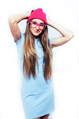 young pretty teenage modern hipster girl posing emotional happy isolated on white background, wearing pink hat and glasses, lifestyle people concept