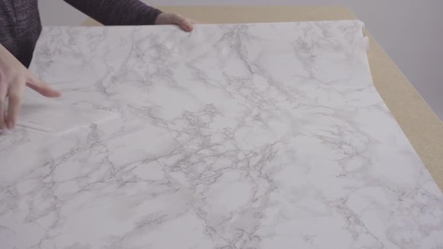 Making marble board with adhesive paper for food photography.