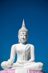 outdoor Thailand landmark beautiful buddhism architecture silver white buddha statues antique meditation in temple have copy space and blue sky background.