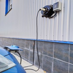 Electric car refueling. Electric car – charging on charge station – electro mobility...