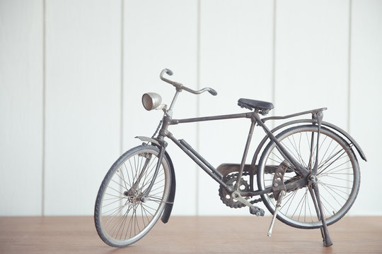 vintage model bicycle on a wood table
