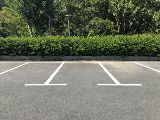 Empty outdoor parking space. Car parking lot with white lines mark. © koosen