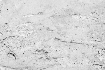 Texture of a concrete wall with cracks and scratches which can be used as a background