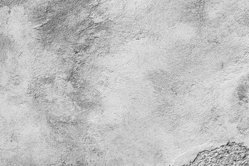 Texture of a concrete wall with cracks and scratches which can be used as a background