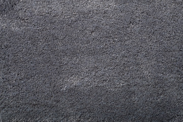 Carpet covering background. Pattern and texture of grey colour carpet. Copy space.