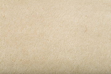 Carpet covering background. Pattern and texture of beige carpet. Copy space.