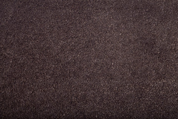 Carpet covering background. Pattern and texture of brown carpet. Copy space.