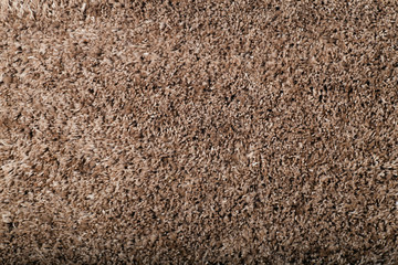 Carpet covering background. Pattern and texture of brown colour carpet. Copy space