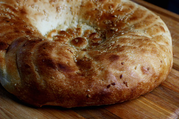 delicious bread with a golden crust sprinkled with sesame seeds