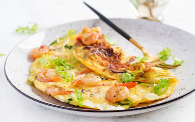 Breakfast. Ketogenic/paleo diet. Omelet with shrimp and herbs. Keto menu. Omelette.