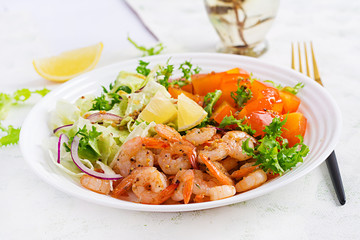 Fruit salad with fried prawns / shrimps, persimmon, red onion and lettuce in white bowls. Appetizers, snack, brunch. Healthy food.