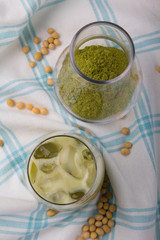 Green matcha in a clear glass on the table