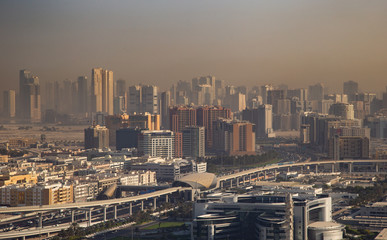 Aerial shot of buildings in Dubai city at sunrise