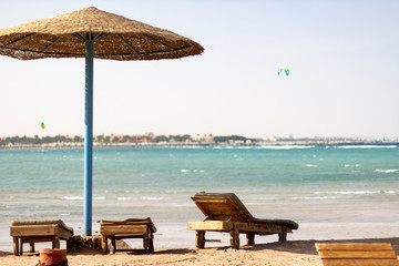 Wooden sun beds by the Red Sea with breathtaking sea views.