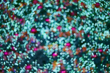 green and pink circular bokeh lights shot with lens blur In order to have a beautiful background