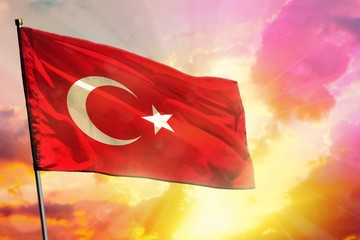Fluttering Turkey flag on beautiful colorful sunset or sunrise background. Success concept.