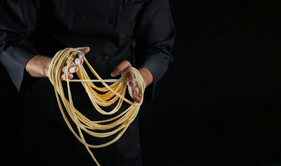 Male hands making fresh homemade pasta
