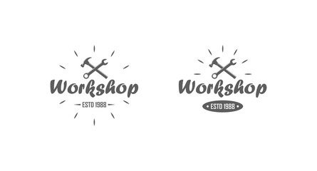 Set of black and white workshop logos. Vector illustration of crossed hammer and wrench, text with rays on a white background.