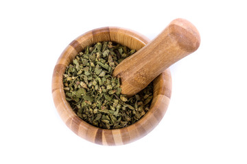 Handful of green dehydrated dried oregano herb