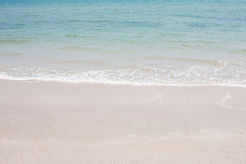 Fototapeta na wymiar soft wave of the sea on the sandy beach.