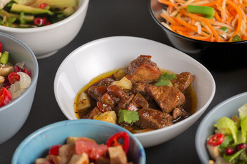 Appetizers and salads, meat and fish dishes of Thai cooking.