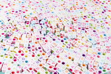 Square alphabet letter beads with multicolored characters