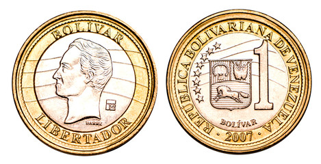 Venezuelan coin one bolivar 2007 release, gold and silver. Currency devaluation. Concept for design. Isolated background.