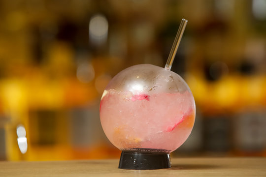 A Glass Of Beautifully Decorated Red Fishbowl Cocktail 