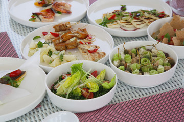 Various healthy fish and vegetables meals served on the table, healthy summer lunch	