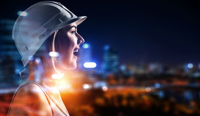 Engineer woman against modern cityscape