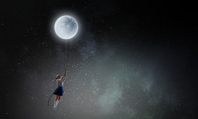 Obraz na płótnie Canvas Kid girl catching moon. Mixed media