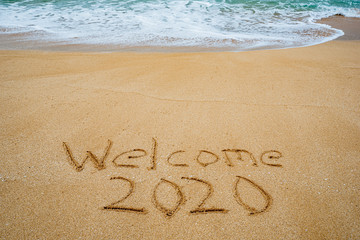 Welcome 2020 written in the sand- New Year’s concept