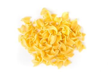 Pile of many yellow dehydrated uncooked egg noodles