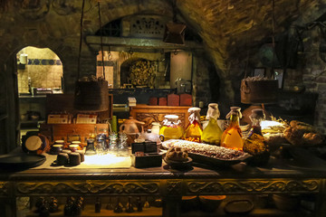rich table with lots of food in a medieval style in the basement