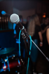 microphone against blur on beverage in pub and restaurant background.