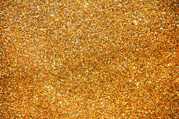 texture of golden shiny fabric with small sparkles