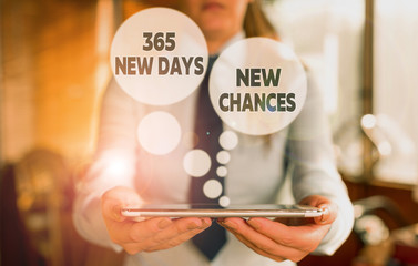Conceptual hand writing showing 365 New Days New Chances. Concept meaning Starting another year Calendar Opportunities Woman in the background pointing with finger in empty space