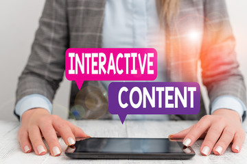 Word writing text Interactive Content. Business photo showcasing It requires the participants active engagement Business woman sitting with mobile phone on the table