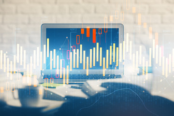 Stock market graph on background with desk and personal computer. Multi exposure. Concept of...
