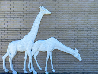 Background of old vintage brick with statue of giraffe wall textures