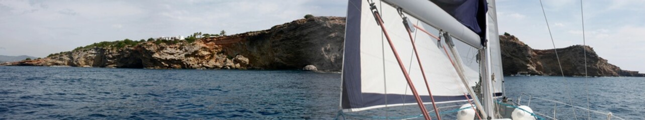 Fototapeta na wymiar Navigating in a sailboat at the Mediterranean coast