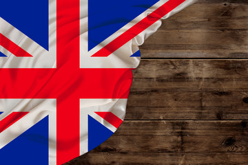 color national flag of modern Great Britain, beautiful silk, background old wood, concept of tourism, economy, politics, emigration, independence day, copy space, template, horizontal